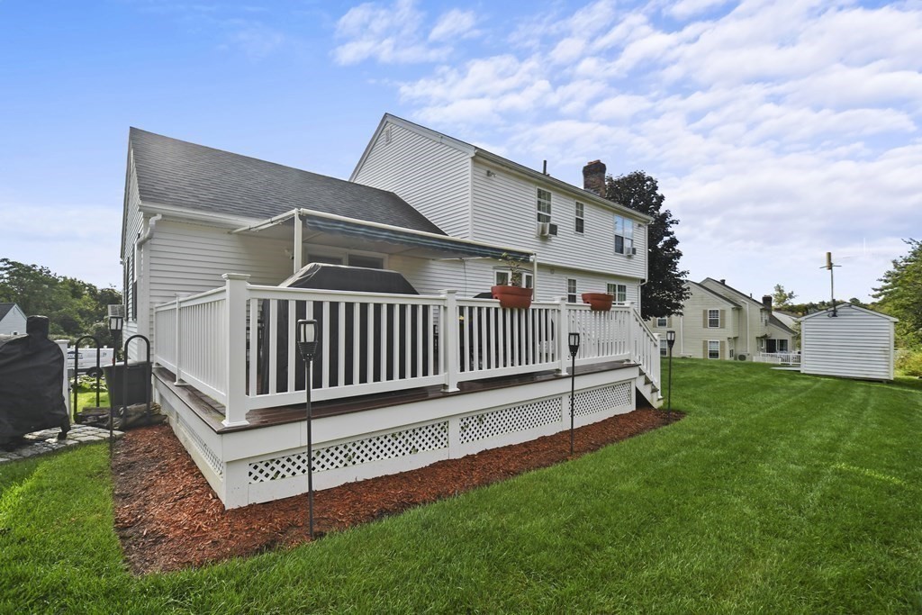 82 Buttermilk Road Leominster, MA 01453 - Photo 33 of 42 a view of a house with a yard and deck