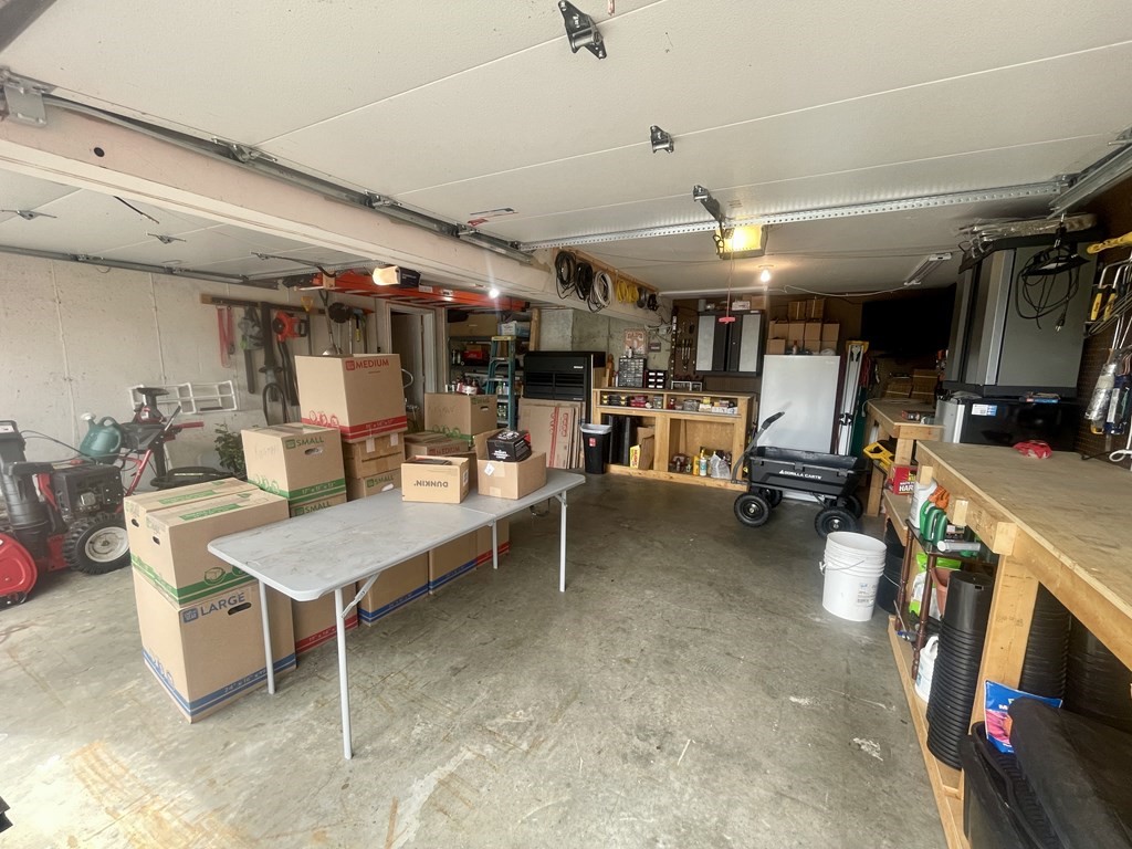 82 Buttermilk Road Leominster, MA 01453 - Photo 42 of 42 a room with furniture and a flat screen tv