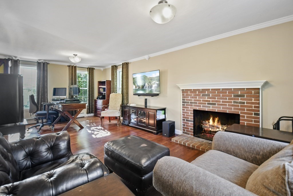 82 Buttermilk Road Leominster, MA 01453 - Photo 5 of 42 a living room with furniture fireplace and window