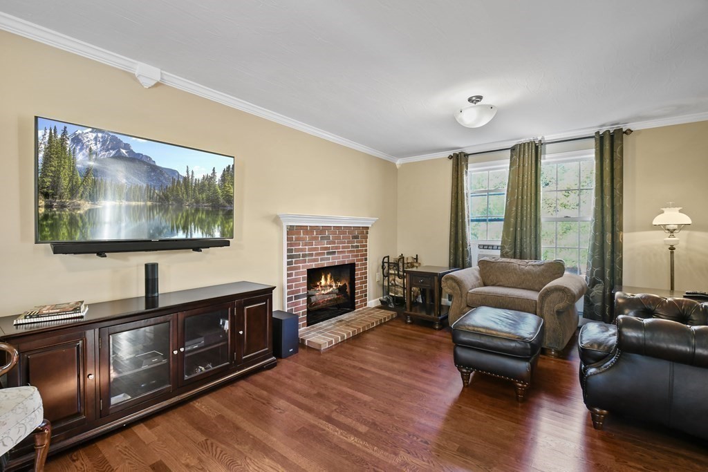 82 Buttermilk Road Leominster, MA 01453 - Photo 6 of 42 a living room with furniture and a flat screen tv