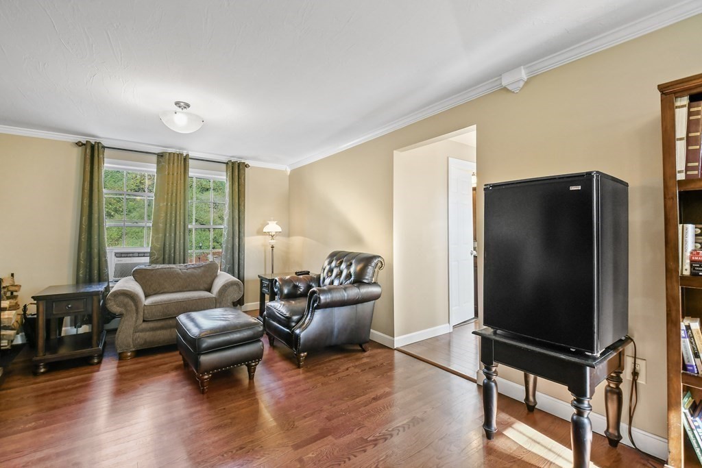 82 Buttermilk Road Leominster, MA 01453 - Photo 7 of 42 a living room with furniture tv and wooden floor