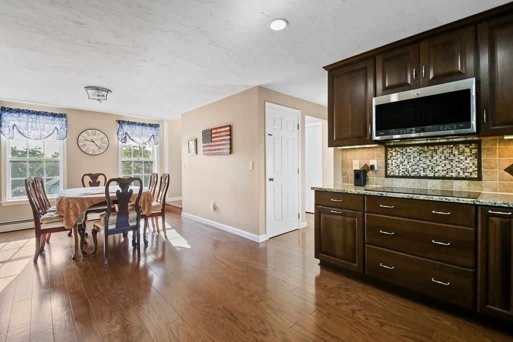 82 Buttermilk Road Leominster, MA 01453 - Photo 10 of 42 a living room with furniture and a flat screen tv