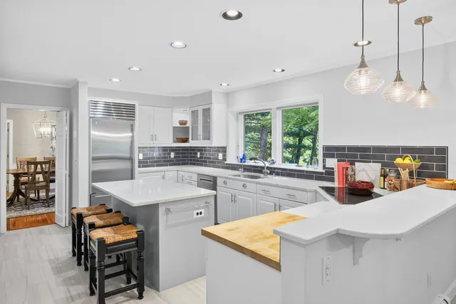 a living room with furniture flat screen tv and a fireplace