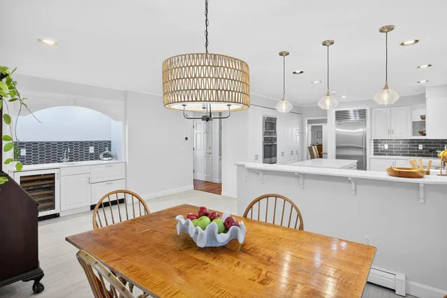 a view of a livingroom with furniture and a window