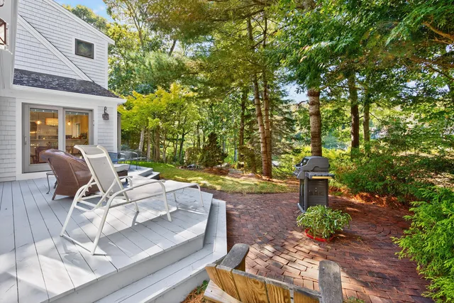 an aerial view of a house with a yard and plants