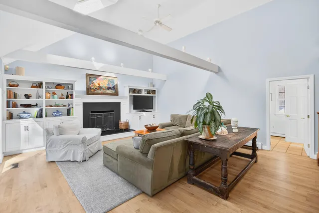 a view of a hallway view with wooden floor and staircase