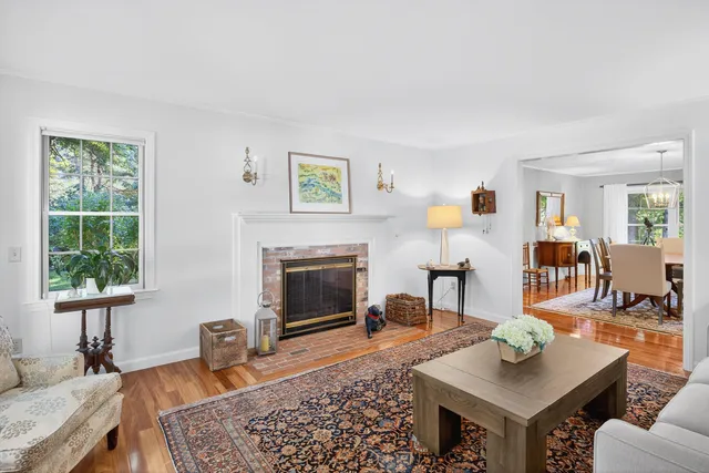 a bathroom with a granite countertop sink a mirror and shower