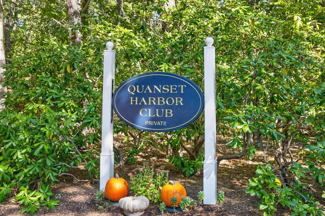 a front view of a house with a yard and outdoor seating