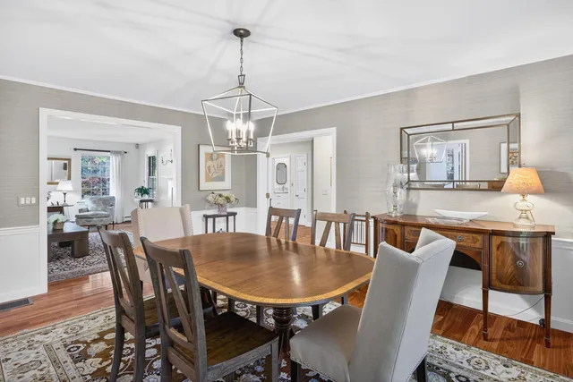a living room with lots of furniture and a book shelf