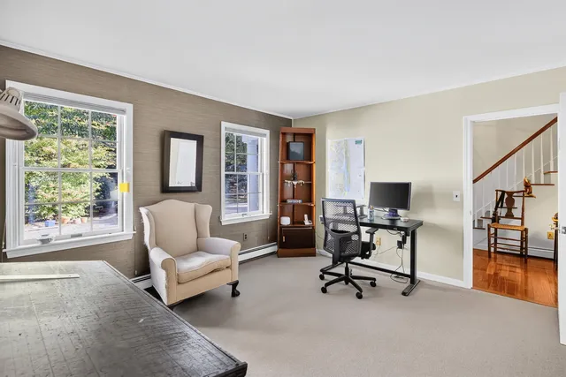 a backyard of a house with lots of green space and garden