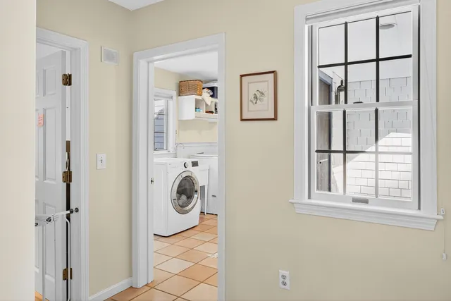 an aerial view of a house with yard and outdoor seating