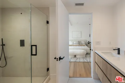 a bathroom with a sink and mirror