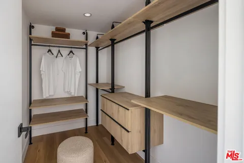 a bathroom with a sink a mirror and a shower