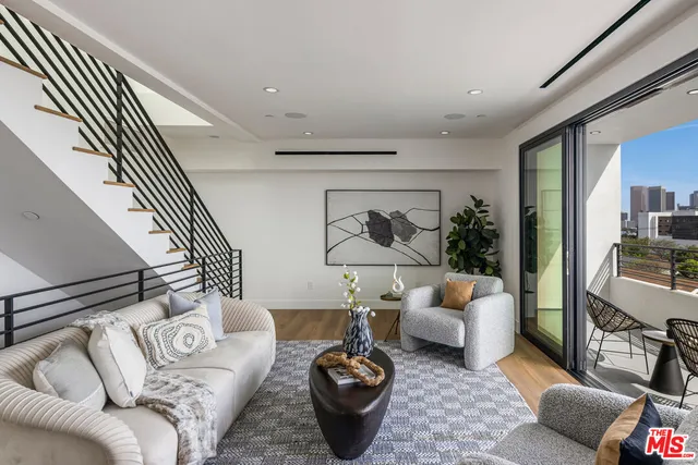 a living room with furniture and a couch