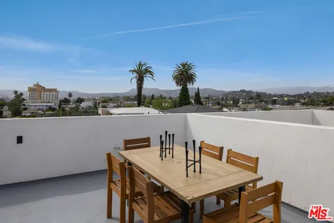 a terrace of a house with outdoor seating