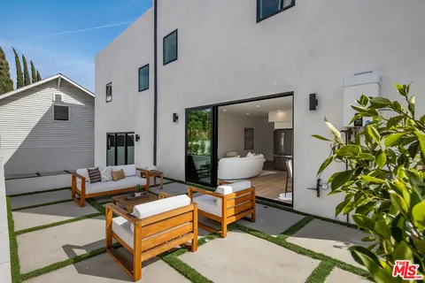 a living room with patio furniture