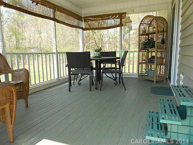 3871 River Road Hickory, NC 28602 - Photo 14 of 16 a view of a dining room with furniture window and wooden floor