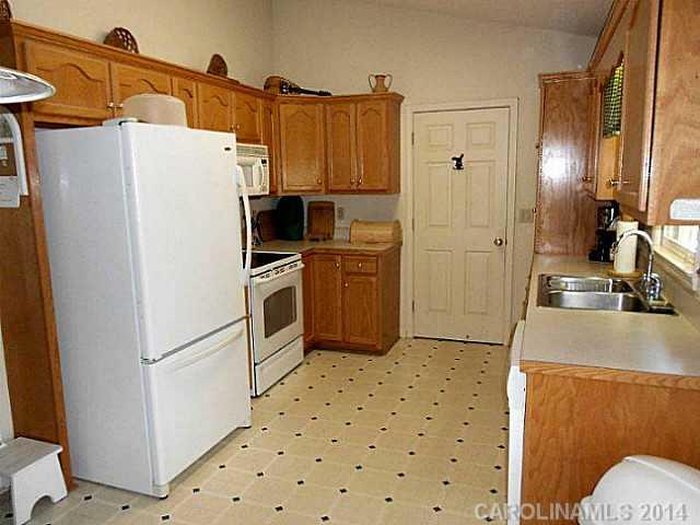 3871 River Road Hickory, NC 28602 - Photo 4 of 16 a kitchen with a refrigerator sink and stove
