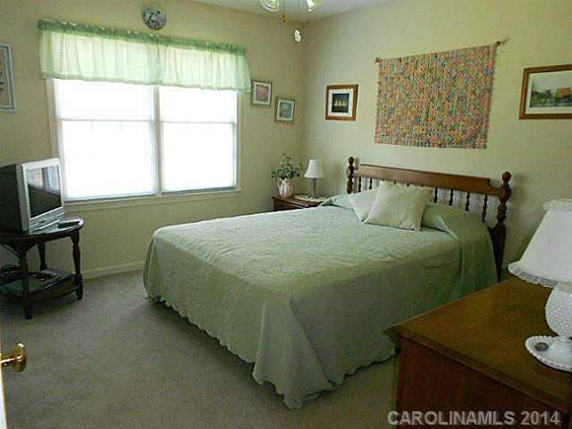 3871 River Road Hickory, NC 28602 - Photo 8 of 16 a bedroom with a bed and a window