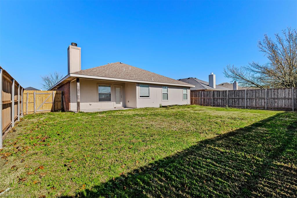 2821 Mockingbird Street Royse City, TX 75189 - Photo 19 of 21 a front view of a house with garden