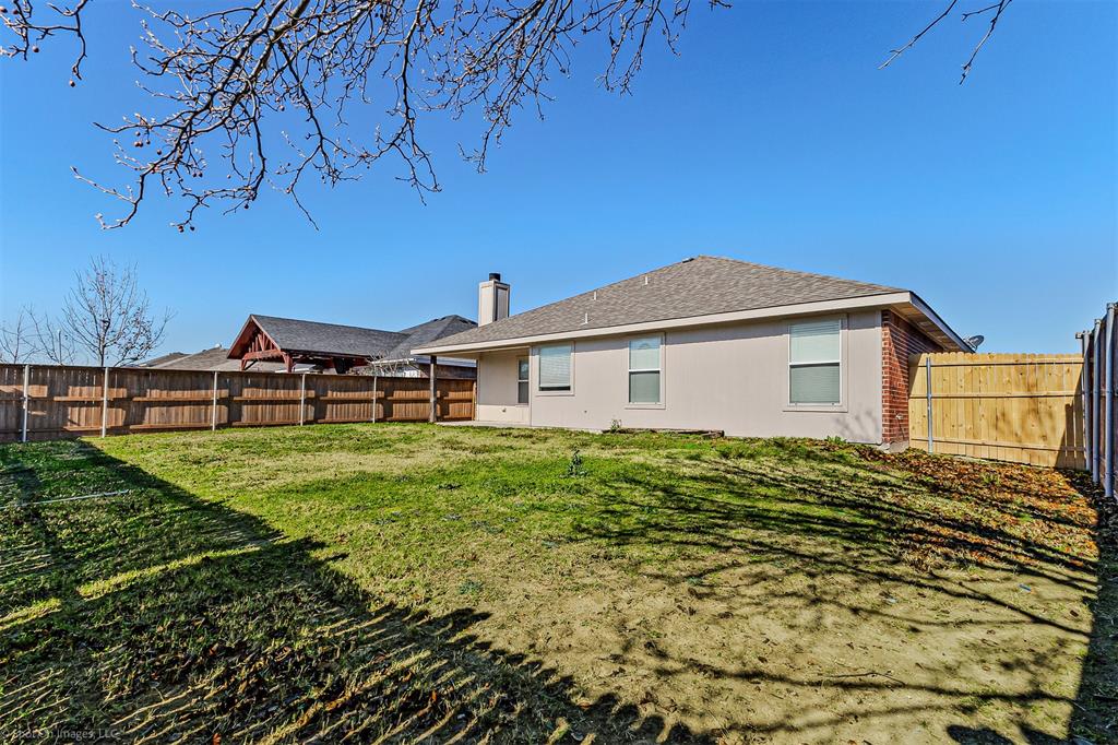 2821 Mockingbird Street Royse City, TX 75189 - Photo 20 of 21 a view of a house with a yard