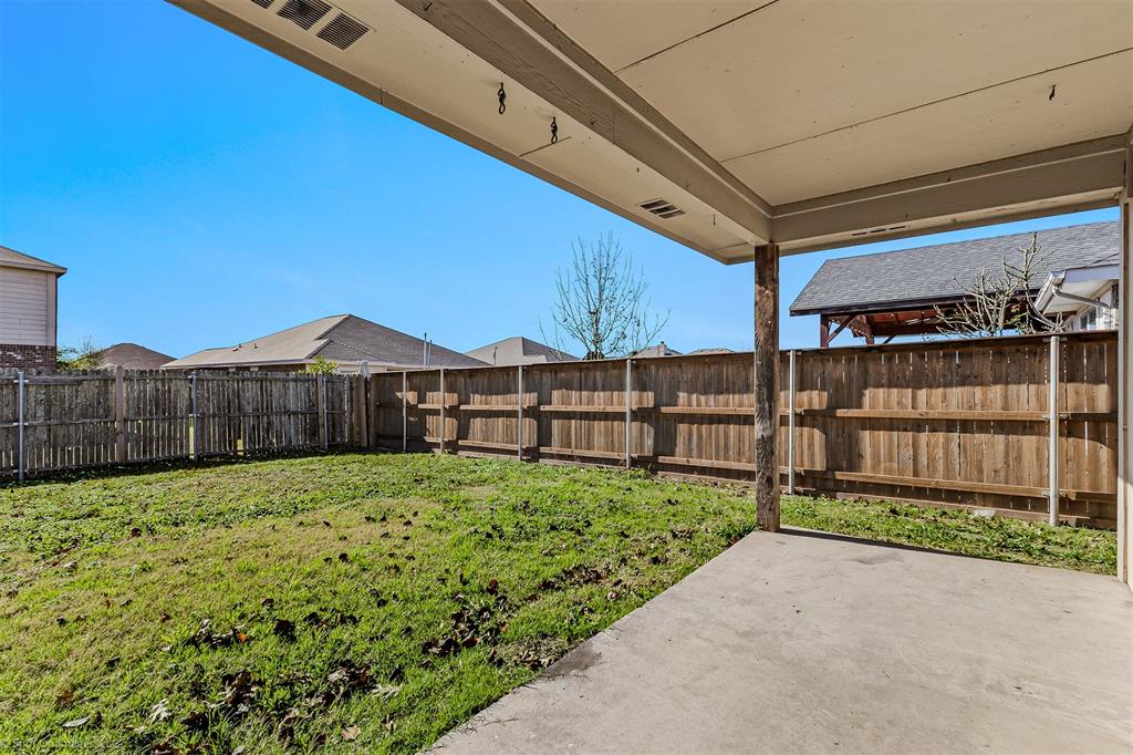 2821 Mockingbird Street Royse City, TX 75189 - Photo 21 of 21 a view of a backyard with wooden fence