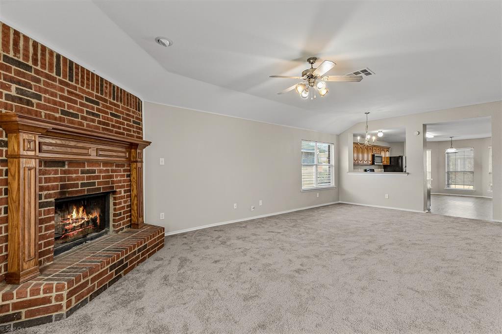 2821 Mockingbird Street Royse City, TX 75189 - Photo 8 of 21 a living room with furniture and a fireplace