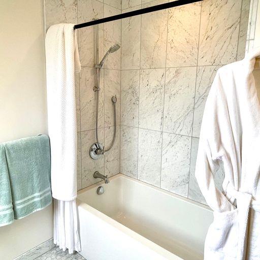 3850 Rio Road, Unit 91 Carmel, CA 93923 - Photo 20 of 31 a bathroom with a bath tub and a shower