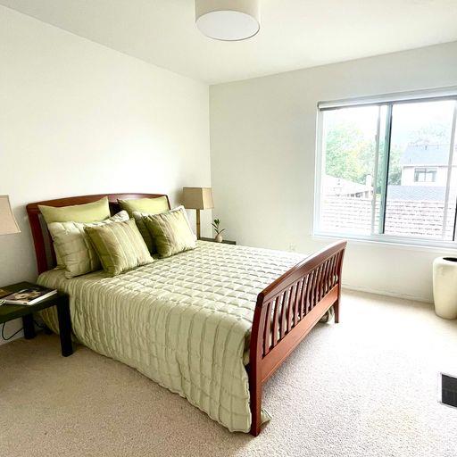 3850 Rio Road, Unit 91 Carmel, CA 93923 - Photo 22 of 31 a bedroom with a bed and a window