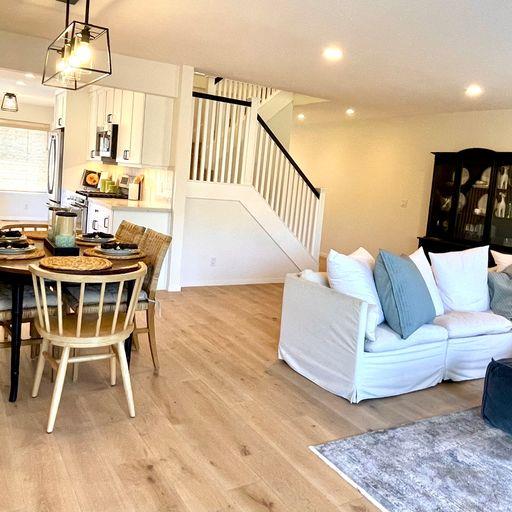 3850 Rio Road, Unit 91 Carmel, CA 93923 - Photo 7 of 31 a living room with furniture and a table