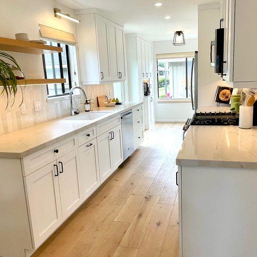 3850 Rio Road, Unit 91 Carmel, CA 93923 - Photo 10 of 31 a large white kitchen with stainless steel appliances