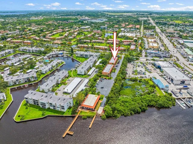 an aerial view of residential houses with outdoor space and street view
