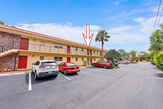 a front view of a house with parking space