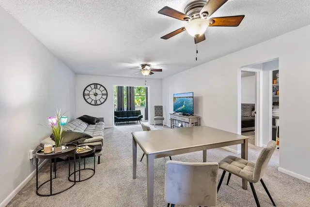 a kitchen with stainless steel appliances a stove microwave and sink