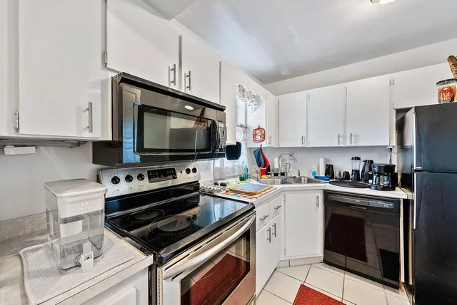 a kitchen with a stove and a microwave