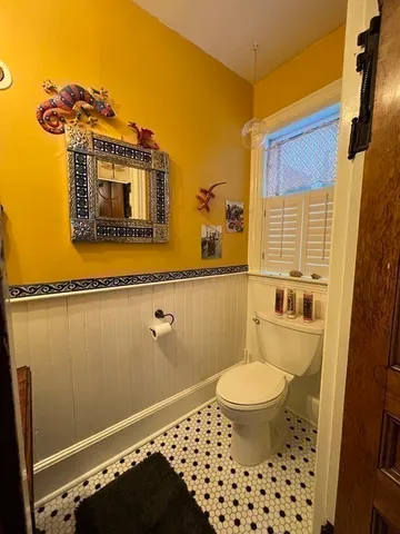 a bathroom with a toilet a sink and a shower