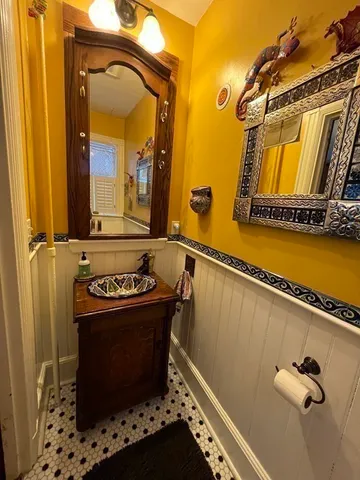 a bathroom with a sink a mirror and a shower