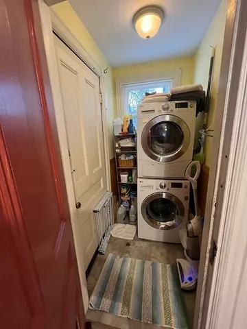 a view of a storage and utility room with washer and dryer