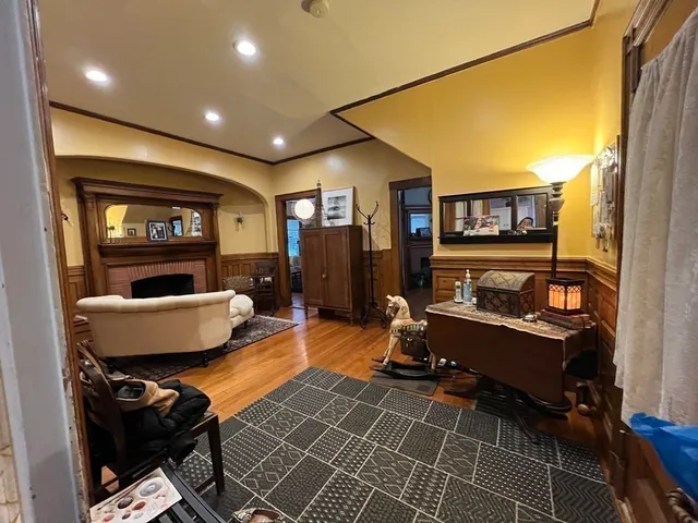 a living room with furniture and a fireplace