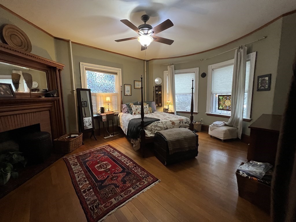 53 University Road, Unit 1 Brookline, MA 02445 - Photo 23 of 27 a living room with furniture and a fireplace