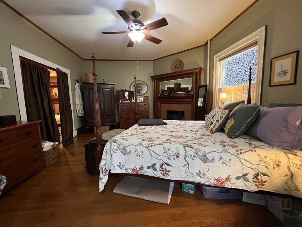 53 University Road, Unit 1 Brookline, MA 02445 - Photo 24 of 27 a bedroom with a bed window and a flat screen tv