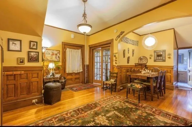 a view of a livingroom with furniture window and wooden floor