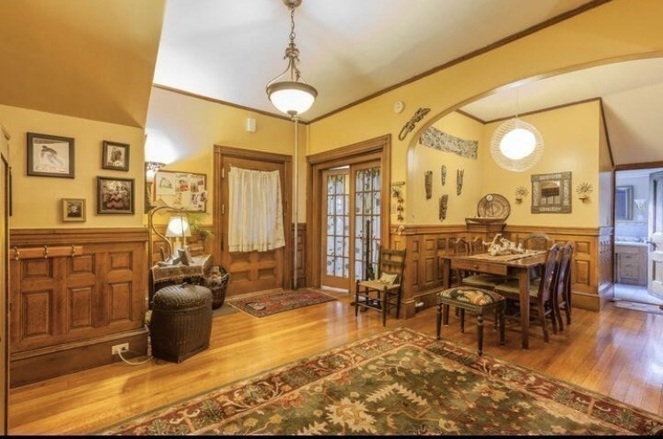 53 University Road, Unit 1 Brookline, MA 02445 - Photo 5 of 27 a view of a livingroom with furniture window and wooden floor