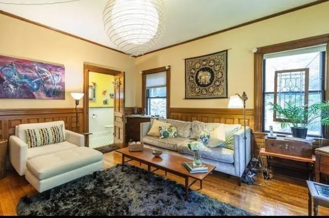 a living room with furniture and a window