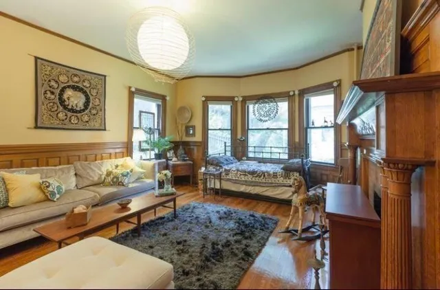 a living room with furniture and a large window