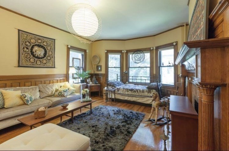 53 University Road, Unit 1 Brookline, MA 02445 - Photo 9 of 27 a living room with furniture and a large window