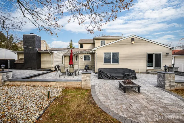 a view of a dinning table and chairs in the patio