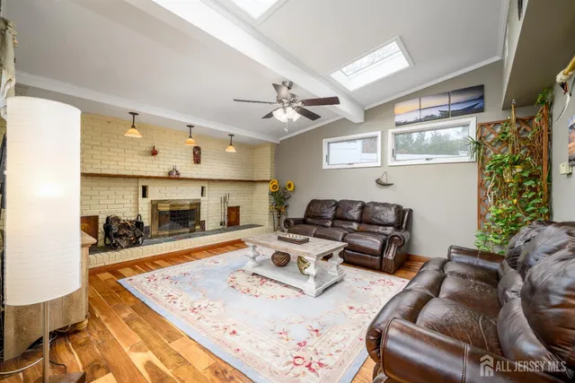 a living room with furniture fireplace and a table