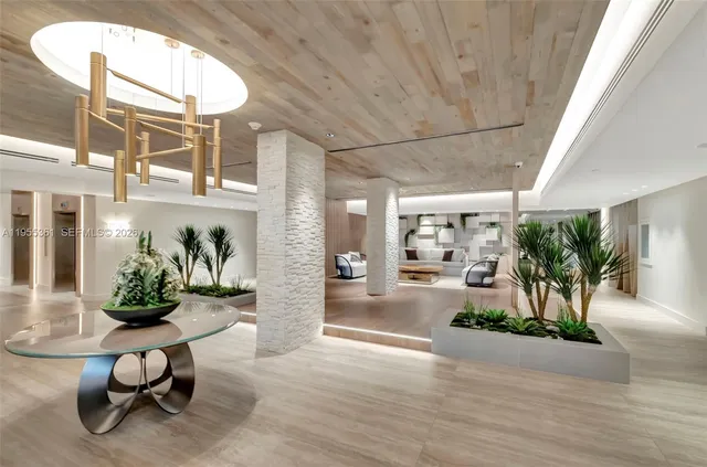 a porch with seating space and potted plants