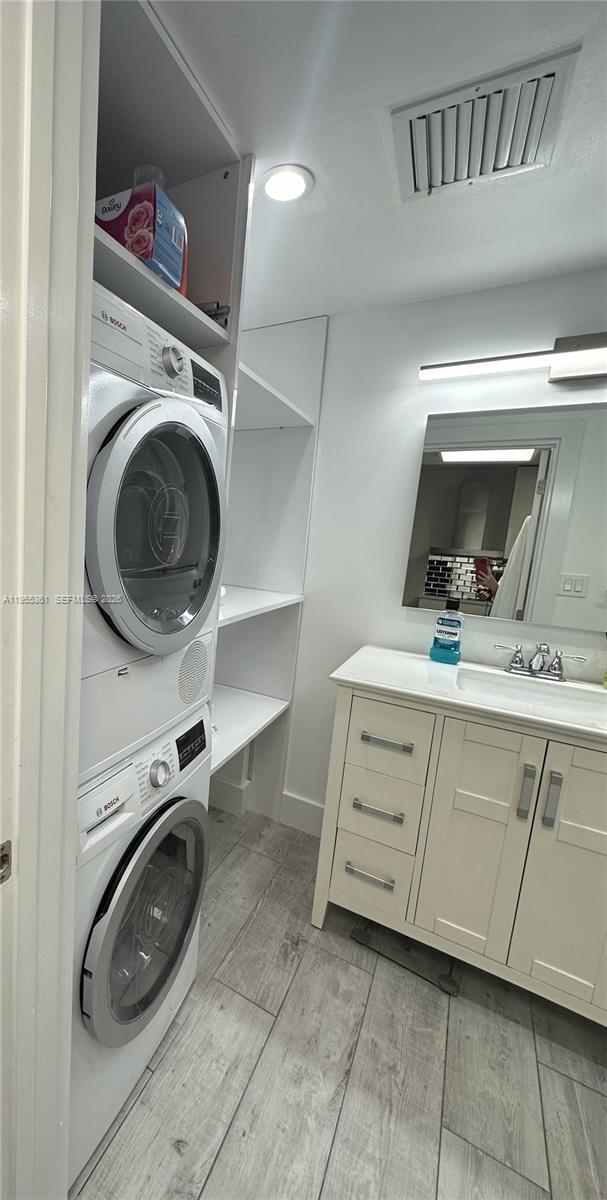 2301 Collins Avenue, Unit 321 Miami Beach, FL 33139 - Photo 14 of 16 a utility room with sink dryer and washer